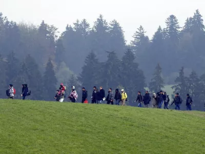 ﻿File photo of migrants crossing a field as they walk from the Austrian village of Kollerschlag towards the Austrian-German border in Wegscheid near Passau, Austria, October 20, 2015. In September, the leaders of Austria and Germany took one of the most pivotal decisions of Europe's refugee crisis, throwing open their borders to tens of thousands of migrants piling up in Hungary. Nearly half a year on, however, the display of unity over the Sept. 5-6 weekend is a distant memory. In a sign of how deep Europe's divisions over refugees have become, Berlin and Vienna snipe at each other almost daily. REUTERS/Michael Dalder/Files