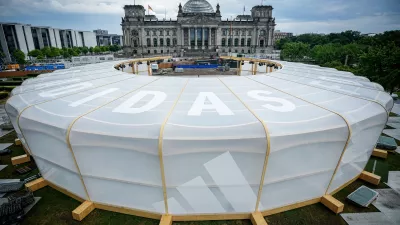 30 May 2024, Berlin: A general view of the Adidas Arena for the European Football Championship is being built on the Reichstag meadow in front of the Reichstag building. Photo: Kay Nietfeld/dpa