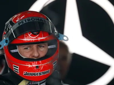 Mercedes Formula One driver Michael Schumacher of Germany stands inside his box before the third practice session of the Chinese F1 Grand Prix at Shanghai International Circuit April 17, 2010.   REUTERS/Jason Lee (CHINA - Tags: SPORT MOTOR RACING)