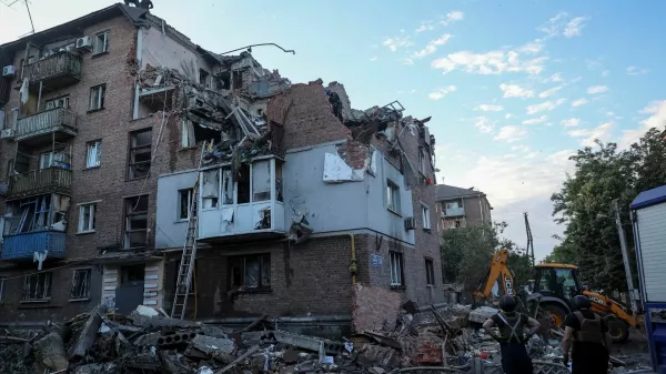 Rescuers work at a site of a residential building hit by a Russian missile strike, amid Russia's attack on Ukraine, in Kharkiv, Ukraine May 31, 2024. REUTERS/Vyacheslav Madiyevskyy