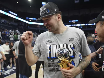 Dallas Mavericks guard Luka Doncic celebrates the team's win over the Minnesota Timberwolves in Game 5 of the Western Conference finals in the NBA basketball playoffs Thursday, May 30, 2024, in Minneapolis. The Mavericks won 124-103, taking the series 4-1 and moving on to the NBA Finals. (AP Photo/Abbie Parr)