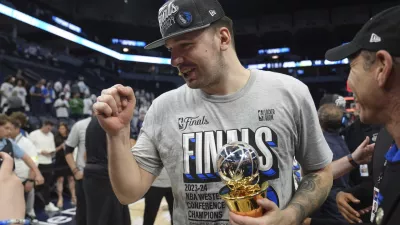 Dallas Mavericks guard Luka Doncic celebrates the team's win over the Minnesota Timberwolves in Game 5 of the Western Conference finals in the NBA basketball playoffs Thursday, May 30, 2024, in Minneapolis. The Mavericks won 124-103, taking the series 4-1 and moving on to the NBA Finals. (AP Photo/Abbie Parr)