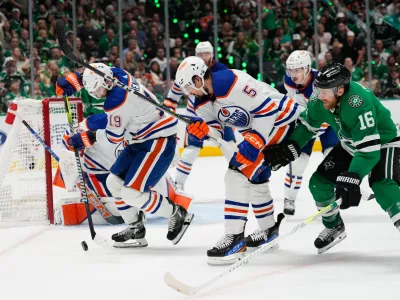 May 31, 2024; Dallas, Texas, USA; Edmonton Oilers center Adam Henrique (19) and Edmonton Oilers defenseman Cody Ceci (5) chase the puck against Dallas Stars center Joe Pavelski (16) during the second period between the Dallas Stars and the Edmonton Oilers in game five of the Western Conference Final of the 2024 Stanley Cup Playoffs at American Airlines Center. Mandatory Credit: Chris Jones-USA TODAY Sports