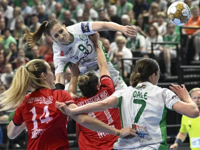 Ana Gros of Gyori, top center, throwss to score during the women's handball Champions League semifinal match between Gyori Audi ETO KC of Hungary and Team Esbjerg of Denmark in Budapest, Hungary, Saturday, June 1, 2024. (Tamas Kovacs/MTI via AP)