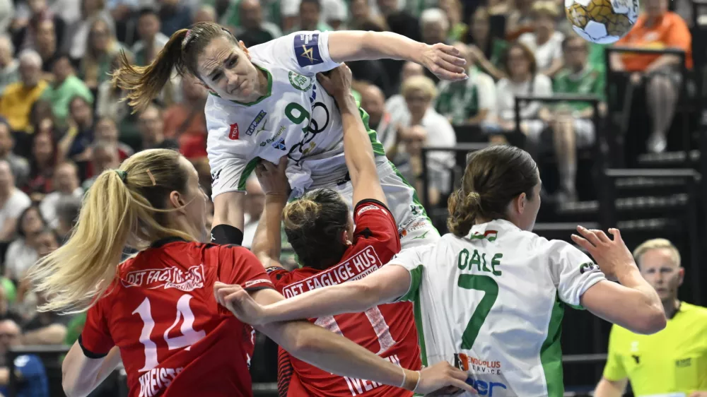 Ana Gros of Gyori, top center, throwss to score during the women's handball Champions League semifinal match between Gyori Audi ETO KC of Hungary and Team Esbjerg of Denmark in Budapest, Hungary, Saturday, June 1, 2024. (Tamas Kovacs/MTI via AP)