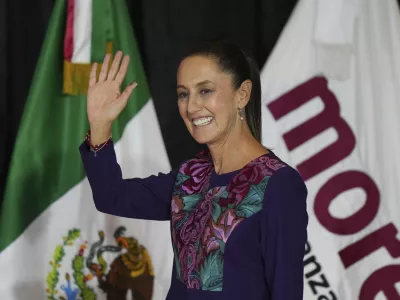 Ruling party presidential candidate Claudia Sheinbaum greets supporters after the National Electoral Institute announced she held an irreversible lead in the election in Mexico City, early Monday, June 3, 2024. (AP Photo/Fernando Llano)