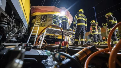 In this photo released by Fire Department of Pardubice region, rescue workers help injured passengers after two trains collided in Pardubice, Czech Republic Thursday, June 6, 2024. A passenger train collided head-on with a freight train in the Czech Republic, killing and injuring some people, officials said early Thursday. (Fire Department of Pardubice region via AP)