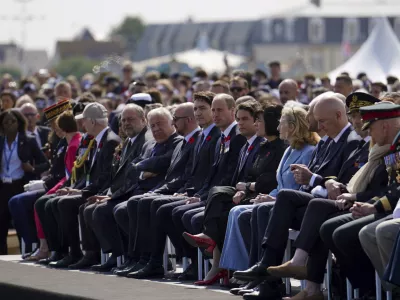 Canadian Prime Minister Justin Trudeau, Britain's Prince William, the Prince of Wales and Prime Minister of France Gabriel Attal sit, during the Government of Canada ceremony to mark the 80th anniversary of D-Day, at Juno Beach, in Courseulles-sur-Mer, Normandy, France, Thursday, June 6, 2024. (Jordan Pettitt, Pool Photo via AP)