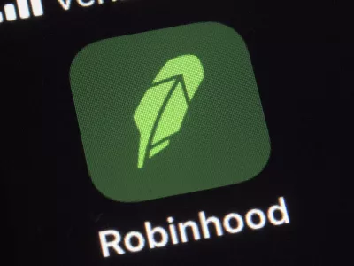 ﻿FILE - This Dec. 17, 2020, photo shows the logo for the Robinhood app on a smartphone in New York. Robinhood, the online brokerage that found itself embroiled in this year's meme stock phenomenon, will seek to go public with a market valuation of up to  billion. The company said in a regulatory filing on Monday, July 19, 2021, that it wanted to price the 55 million shares in its initial public offering in a range of  to  per share. It could raise approximately .3 billion if shares are sold at the high end of the range. (AP Photo/Patrick Sison, File)