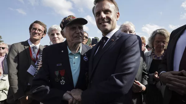 French President Emmanuel Macron meets with US WW II veteran Steven Melnikoff, center left, during a ceremony in tribute to the civilian victims of World War II, ahead of celebrations for the 80th anniversary of D-Day landing in Normandy, in Saint-Lo, Wednesday, June 52024. (Christophe Petit Tesson, Pool via AP)