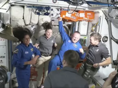 NASA astronauts Butch Wilmore and Suni Williams are greeted by the crew of the International Space Station on Thursday, June 6, 2024. (NASA via AP)