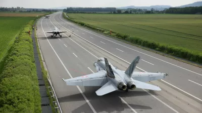 Swiss Air Force F/A-18 fighter jets are seen on the motorway during the Alpha Uno drill in Payerne, Switzerland, June 5, 2024. Philipp Schmidli/Swiss Army/Handout via REUTERS ATTENTION EDITORS - THIS IMAGE HAS BEEN SUPPLIED BY A THIRD PARTY. NO RESALES. NO ARCHIVES