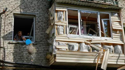 A woman cleans debris from an apartment in a multi-storey residential building damaged in recent shelling by U.S.-supplied ATACMS missiles, according the Russian Defence Ministry, in the course of Russia-Ukraine conflict in Luhansk, Russian-controlled Ukraine, June 7, 2024. REUTERS/Alexander Ermochenko   TPX IMAGES OF THE DAY