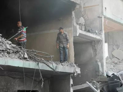 Palestinians inspect a house hit in an Israeli strike, due to an Israeli military operation, amid the Israel-Hamas conflict, in Nuseirat refugee camp in the central Gaza Strip, June 8, 2024. REUTERS/Ramadan Abed