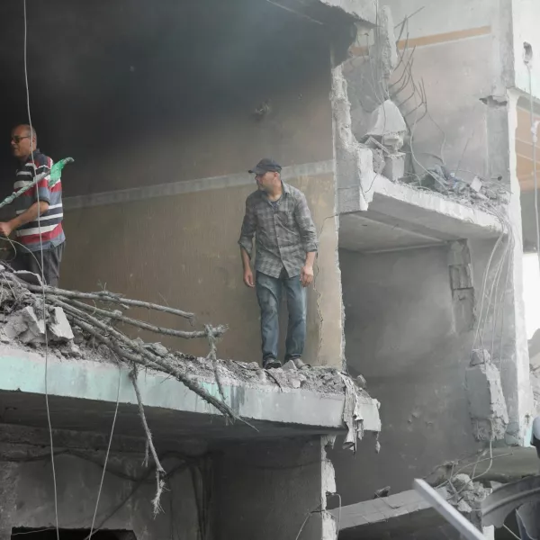 Palestinians inspect a house hit in an Israeli strike, due to an Israeli military operation, amid the Israel-Hamas conflict, in Nuseirat refugee camp in the central Gaza Strip, June 8, 2024. REUTERS/Ramadan Abed