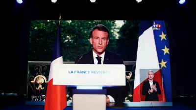 French President Emmanuel Macron speaks through a screen at the far-right National Rally (Rassemblement National - RN) party headquarters after the polls closed during the European Parliament elections, in Paris, France, June 9, 2024. REUTERS/Sarah Meyssonnier