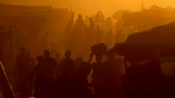 Palestinians walk and travel along a street, in an area where houses have been destroyed in Israeli strikes, amid the Israel-Hamas conflict, in Khan Younis, in the southern Gaza Strip, June 9, 2024. REUTERS/Mohammed Salem   TPX IMAGES OF THE DAY