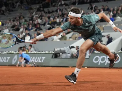 Norway's Casper Ruud plays a shot against Denmark's Holger Rune during their quarterfinal match at the French Open tennis tournament in Roland Garros stadium in Paris, France, Wednesday, June 1, 2022. (AP Photo/Michel Euler)