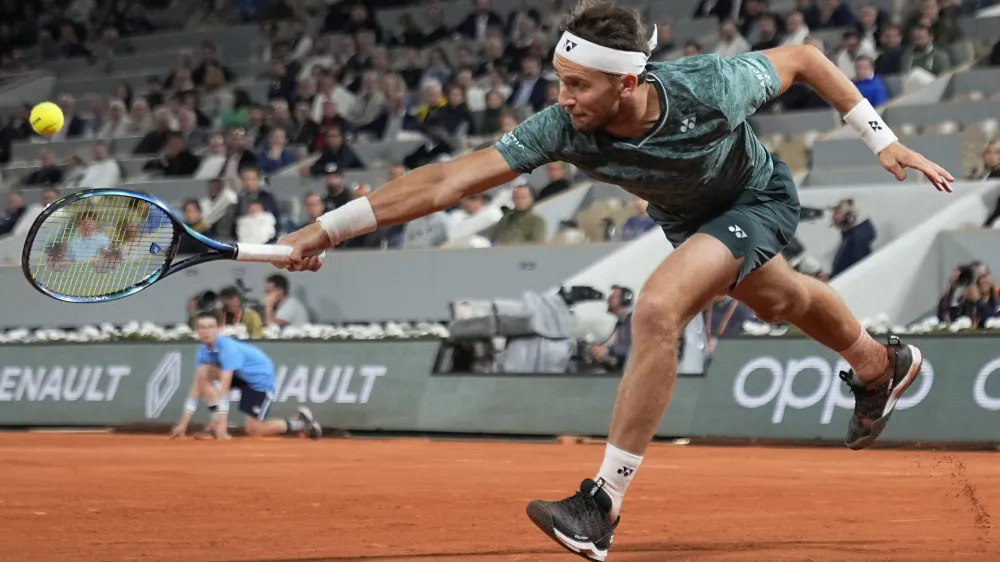 Norway's Casper Ruud plays a shot against Denmark's Holger Rune during their quarterfinal match at the French Open tennis tournament in Roland Garros stadium in Paris, France, Wednesday, June 1, 2022. (AP Photo/Michel Euler)