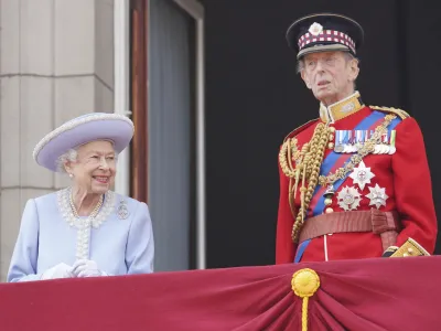 Queen Elizabeth II and the Duke of Kent watch from the balcony of Buckingham Place after the Trooping the Color ceremony in London, Thursday, June 2, 2022, on the first of four days of celebrations to mark the Platinum Jubilee. The events over a long holiday weekend in the U.K. are meant to celebrate the monarch's 70 years of service. (Jonathan Brady/Pool Photo via AP)