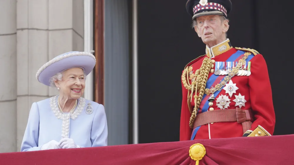 Queen Elizabeth II and the Duke of Kent watch from the balcony of Buckingham Place after the Trooping the Color ceremony in London, Thursday, June 2, 2022, on the first of four days of celebrations to mark the Platinum Jubilee. The events over a long holiday weekend in the U.K. are meant to celebrate the monarch's 70 years of service. (Jonathan Brady/Pool Photo via AP)