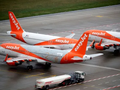 FILE PHOTO: EasyJet airplanes are parked on the tarmac during the official opening of the new Berlin-Brandenburg Airport (BER) "Willy Brandt", in Schoenefeld near Berlin, Germany October 31, 2020. REUTERS/Hannibal Hanschke/Pool/File Photo