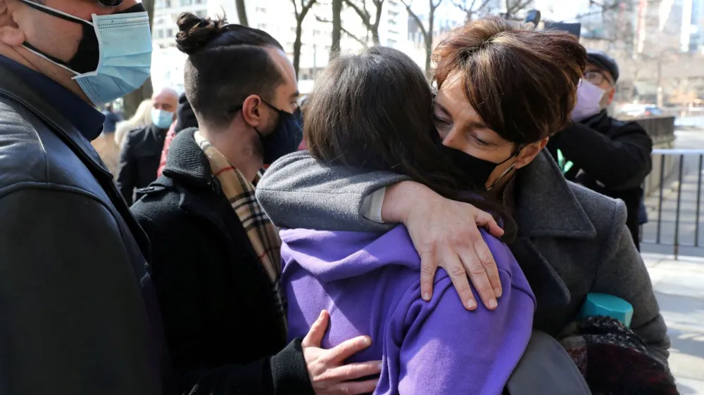 FILE PHOTO: Families of the victims of a deadly 2018 van attack react after the verdict in the trial of Alek Minassian was delivered, outside the provincial Superior Court of Justice in Toronto, Ontario, Canada March 3, 2021. REUTERS/Chris Helgren/File Photo