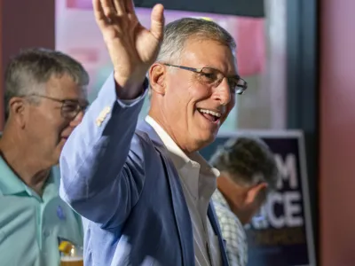 South Carolina Rep. Tom Rice greets supporters at Brother's Grill in Myrtle Beach, S.C., as he waits for primary election results to come in, Tuesday, June 14, 2022. (Jason Lee/The Sun News via AP)