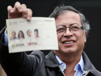 FILE PHOTO: Colombia's Gustavo Petro of the Historic Pact coalition shows his ballot before casting his vote at a polling station during the second round of the presidential election in Bogota, Colombia June 19, 2022. REUTERS/Luisa Gonzalez/File Photo