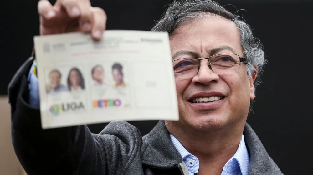 FILE PHOTO: Colombia's Gustavo Petro of the Historic Pact coalition shows his ballot before casting his vote at a polling station during the second round of the presidential election in Bogota, Colombia June 19, 2022. REUTERS/Luisa Gonzalez/File Photo