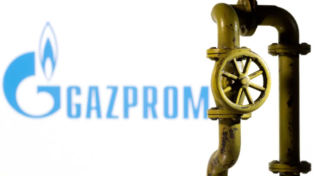 FILE PHOTO: A 3D printed natural gas pipeline is placed in front of displayed Gazprom logo in this illustration taken February 8, 2022. REUTERS/Dado Ruvic/Illustration/File Photo