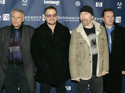 U2 band members, from left, Adam Clayton, Bono, The Edge, and Larry Mullen Jr. arrive at the premiere of their film 'U2 3D' at the Sundance Film Festival in Park City, Utah, on Saturday, Jan. 19, 2008. (AP Photo/Amy Sancetta)