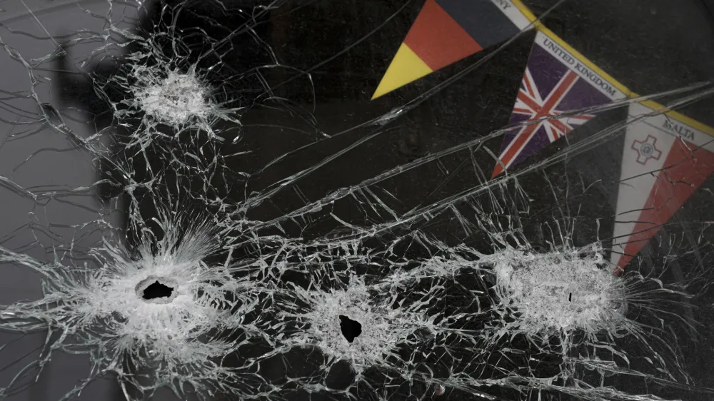 The windshield of an abandoned truck is riddled by bullets in Stoyanka, Ukraine, Sunday, March 27, 2022. (AP Photo/Vadim Ghirda)