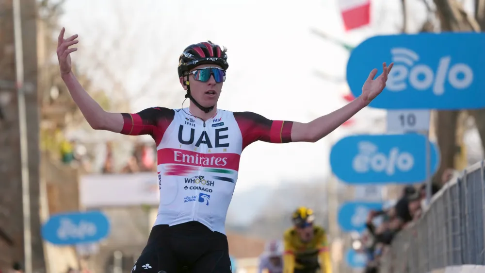 Slovenia's Tadej Pogacar crosses the finish line to win the fourth stage of the Tirreno Adriatico cycling race, from Cascate delle Marmore to Bellante, Italy, Thursday, March 10, 2022. (Gian Mattia D'Alberto/LaPresse via AP)