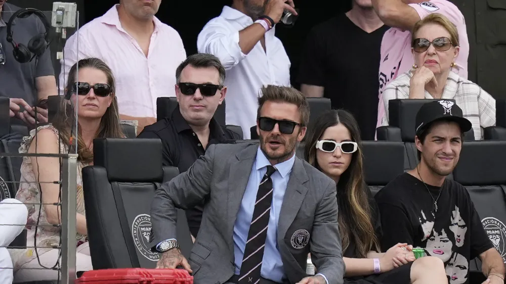 David Beckham, center, a co-owner and president of soccer operations for Inter Miami, watches an MLS soccer match against Los Angeles FC, Saturday, March 12, 2022, in Fort Lauderdale, Fla. (AP Photo/Rebecca Blackwell)