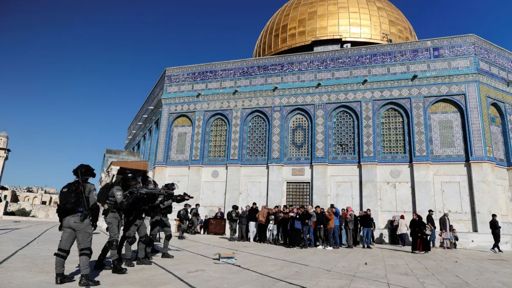 Israeli security forces move in positions during clashes with Palestinian protestors at the compound that houses Al-Aqsa Mosque, known to Muslims as Noble Sanctuary and to Jews as Temple Mount, in Jerusalem's Old City April 15, 2022. REUTERS/Ammar Awad