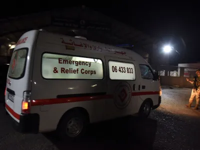 An ambulance drives at the entrance of the port of Tripoli, following the sinking of a boat off the coast of Lebanon's northern port city of Tripoli, in Tripoli, Lebanon April 23, 2022. Picture taken April 23, 2022. REUTERS/Omar Ibrahim