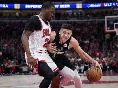 Milwaukee Bucks guard Grayson Allen, right, drives as Chicago Bulls forward Javonte Green guards during the second half of Game 4 of a first-round NBA basketball playoff series Sunday, April 24, 2022, in Chicago. (AP Photo/Nam Y. Huh)