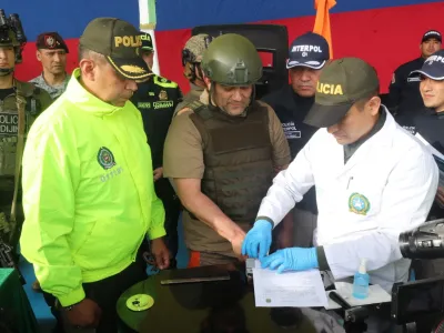 Police officers perform the formalities for extradition of Colombian drug trafficker Dairo Antonio Usuga David, also known as "Otoniel", as Colombia extradites him to the United States, in Bogota, Colombia May 4, 2022. Colombia Policia Nacional (PONAL)/Handout via REUTERS ATTENTION EDITORS - THIS IMAGE WAS PROVIDED BY A THIRD PARTY. NO RESALES. NO ARCHIVES