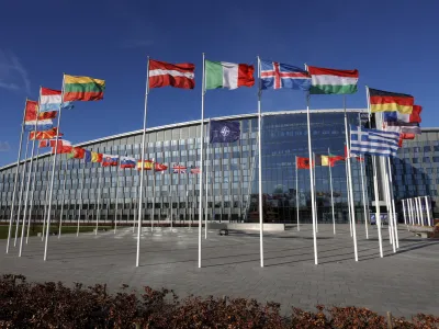 FILE - Flags flutter in the wind outside NATO headquarters in Brussels, Feb. 7, 2022. Finland and Sweden have signaled their intention to join NATO over Russia's war in Ukraine and things will move fast once they formally apply for membership in the world's biggest security alliance. Russian President Vladimir Putin has already made clear that there would be consequences if the two Nordic countries join. (AP Photo/Olivier Matthys, File)