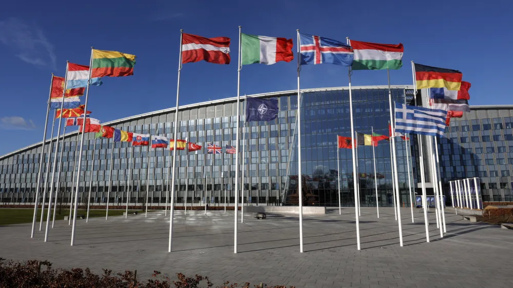 FILE - Flags flutter in the wind outside NATO headquarters in Brussels, Feb. 7, 2022. Finland and Sweden have signaled their intention to join NATO over Russia's war in Ukraine and things will move fast once they formally apply for membership in the world's biggest security alliance. Russian President Vladimir Putin has already made clear that there would be consequences if the two Nordic countries join. (AP Photo/Olivier Matthys, File)