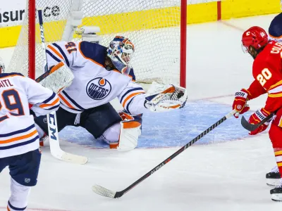 May 26, 2022; Calgary, Alberta, CAN; Edmonton Oilers goaltender Mike Smith (41) makes a save against the Calgary Flames during the third period in game five of the second round of the 2022 Stanley Cup Playoffs at Scotiabank Saddledome. Mandatory Credit: Sergei Belski-USA TODAY Sports