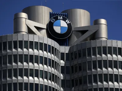 FILE - The logo of German car manufacturer BMW is fixed at the headquarters in Munich, Germany, May 14, 2021. German automaker BMW reports second-quarter earnings on Tuesday Aug. 3, 2021. BMW said Wednesday, March 16, 2022 that bottlenecks at its suppliers in Ukraine have forced it to adjust or interrupt production at a number of factories, which is likely to have a negative impact on auto sales figures. (AP Photo/Matthias Schrader, file)