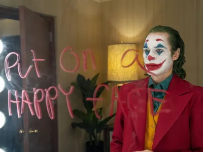 This image released by Warner Bros. Pictures shows Joaquin Phoenix in a scene from the film, "Joker." (Niko Tavernise/Warner Bros. Pictures via AP)