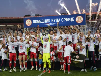Red Star players celebrate after winning Serbia's national Cup final soccer match between Red Star and Partizan in Belgrade, Serbia, Sunday, May 26, 2022. (AP Photo/Darko Vojinovic)