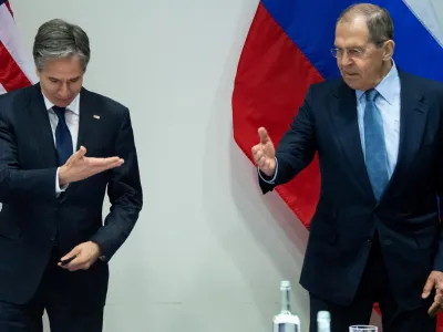 U.S. Secretary of State Antony Blinken and Russian Foreign Minister Sergey Lavrov gesture as they arrive for a meeting at the Harpa Concert Hall, on the sidelines of the Arctic Council Ministerial summit, in Reykjavik, Iceland, May 19, 2021. Saul Loeb/Pool via REUTERS   TPX IMAGES OF THE DAY - RC29JN9UI678