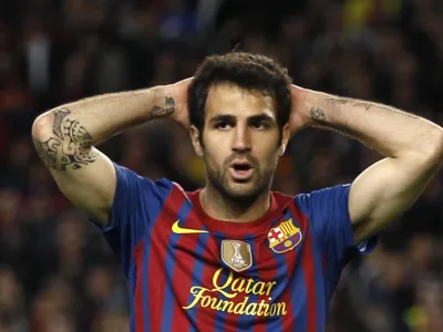 Barcelona's Francesc Fabregas reacts after missing a scoring opportunity during their Champions League semi-final second leg soccer match against Chelsea at Camp Nou stadium in Barcelona, April 24, 2012. REUTERS/Stefan Wermuth (SPAIN - Tags: SPORT SOCCER) 