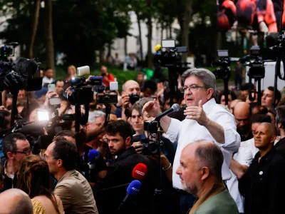 Jean-Luc Melenchon, leader of French far-left opposition party La France Insoumise (France Unbowed), member of parliament and leader of left-wing coalition New Ecologic and Social People's Union (NUPES) speaks after early results following the second round of French parliamentary elections, in Paris, France, June 19, 2022.REUTERS/Gonzalo Fuentes