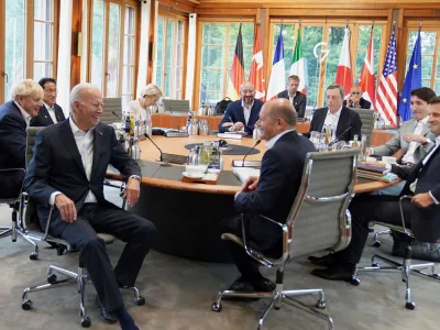 Britain's Prime Minister Boris Johnson, Japan's Prime Minister Fumio Kishida, U.S. President Joe Biden, Germany's Chancellor Olaf Scholz, European Commission President Ursula von der Leyen, France's President Emmanuel Macron, Canadian Prime Minister Justin Trudeau and Italy's Prime Minister Mario Draghi attend a meeting alongside the G7 leaders summit at Bavaria's Schloss Elmau, near Garmisch-Partenkirchen, Germany June 28, 2022. Stefan Rousseau/Pool via REUTERS