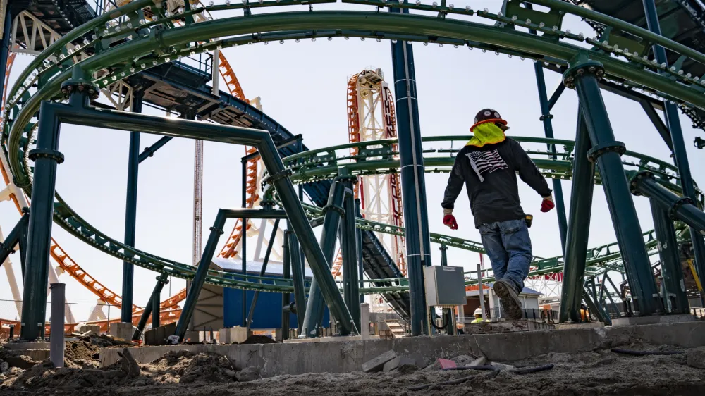 Construction is underway in the amusement park district of Coney Island, Friday, June 17, 2022, in the Brooklyn borough of New York. Luna Park in Coney Island will open three new major attractions this season alongside new recreational areas and pedestrian plazas. (AP Photo/John Minchillo)